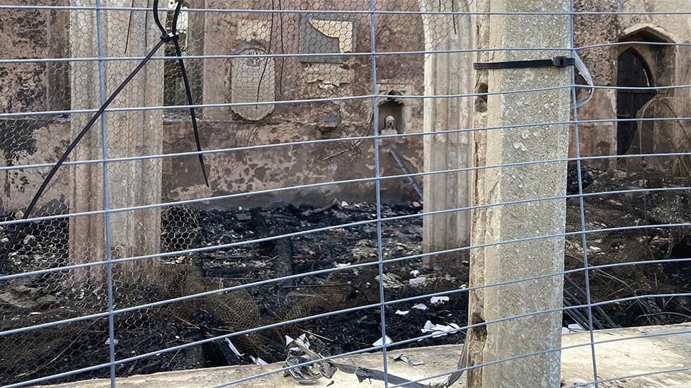 View through window of Beachamwell fire-hit church