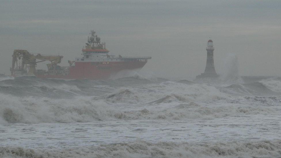 A ship riding the waves of a stormy sea