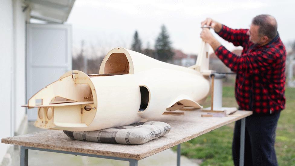 A modeler making an aircraft