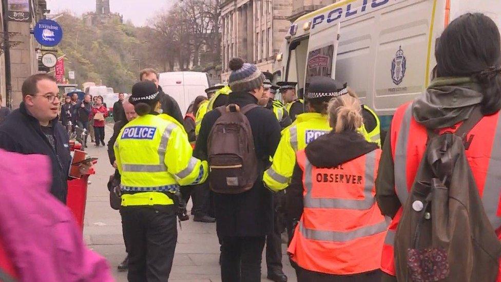 protesters being led away be police