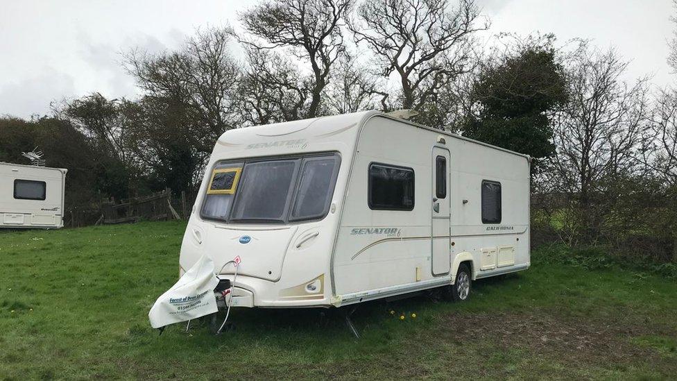 A caravan in a field