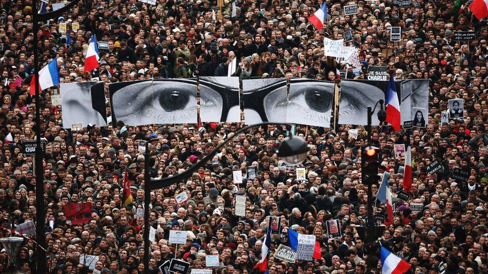 Demonstrators make their way along Boulevard Voltaire in a unity rally in Paris following the terrorist attacks in January 2015