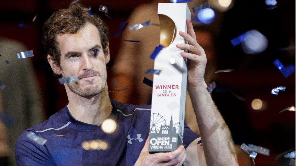 Andy Murray holding trophy