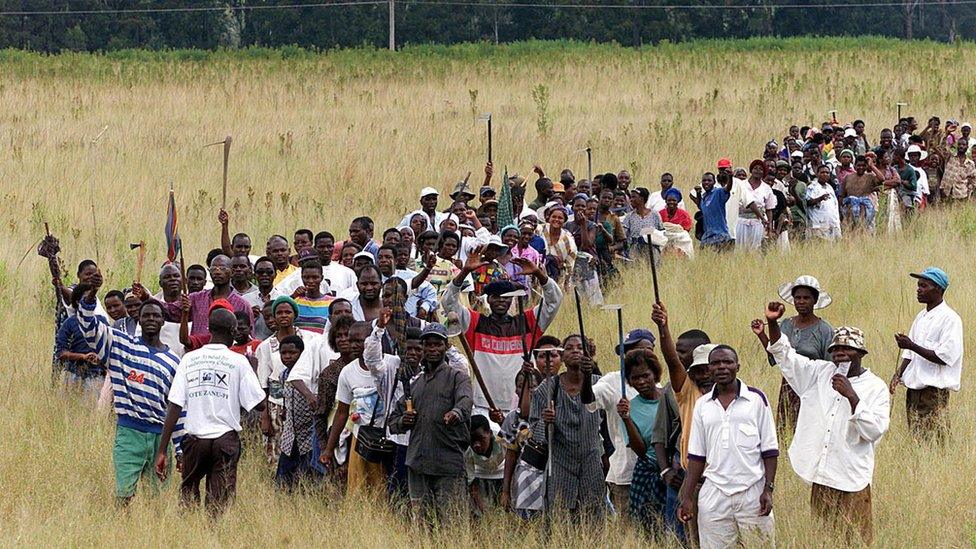 Zimbabweans staging a land invasion