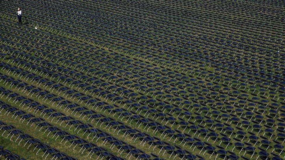 20,000 empty chairs laid out on the lawn behind the White House