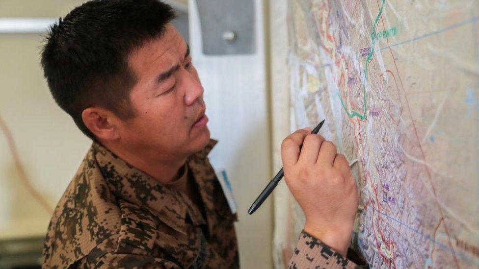 A Mongolian officer participates in a training simulation