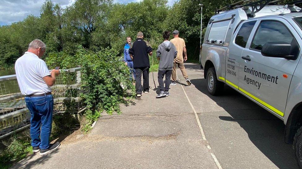 Environment Agency staff and vehicles at the lake in Swindon