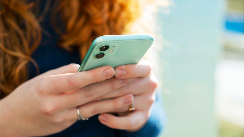 Close up or woman using smart phone - stock photo