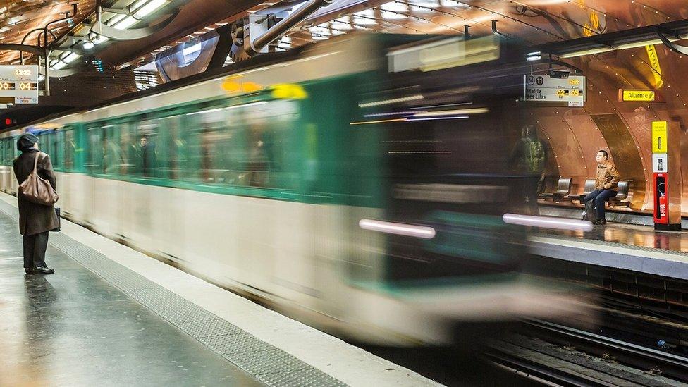 An underground train arriving in a station