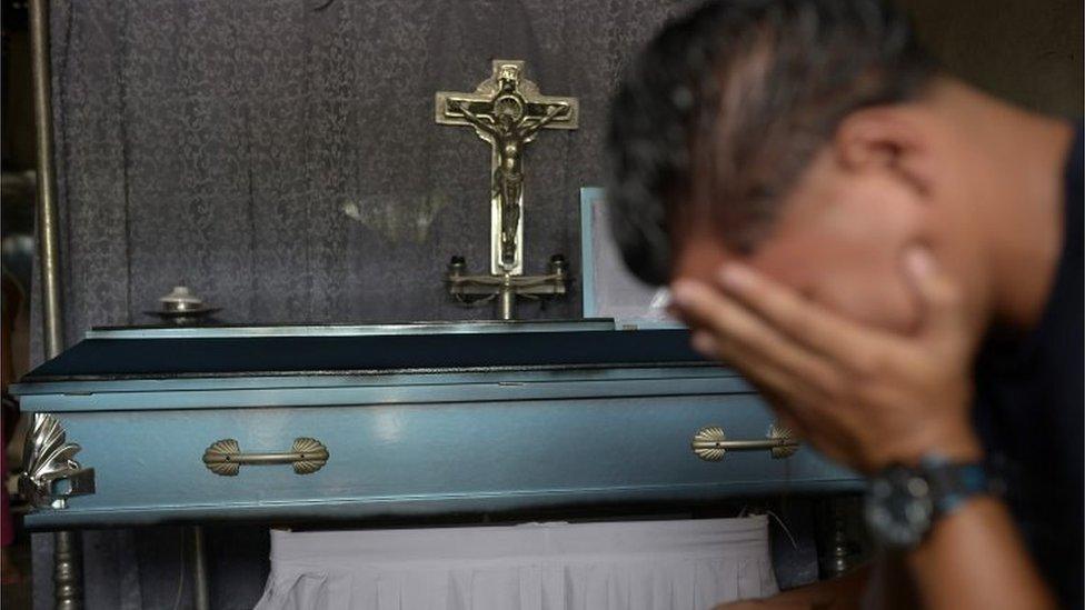 A man mourns during the funeral of 21-year-old Bryan Picado, who died during clashes with members of Nicaragua's Special Forces, in the Sandino neighbourhood in Jinotega on July 24, 2018.