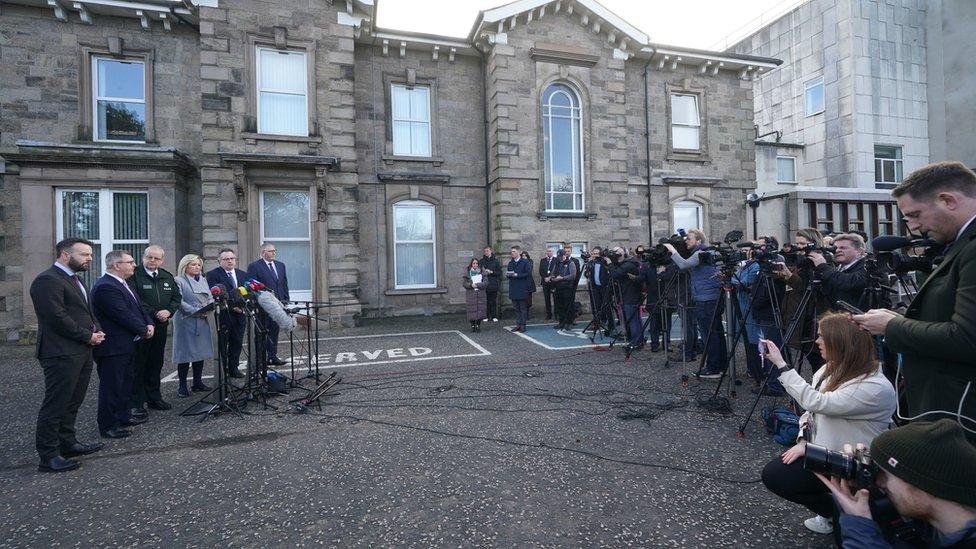 SDLP leader Colum Eastwood, DUP leader Jeffrey Donaldson, Police Service of Northern Ireland (PSNI) Chief Constable Simon Byrne, Sinn Fein deputy leader Michelle O'Neill, Stephen Farry from the Alliance party, and Ulster Unionist Party (UUP) leader Doug Beattie, speaking to the media outside the PSNI HQ in Belfast