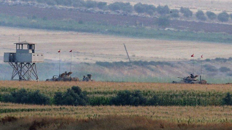 The Turkish army holds positions near the Syrian border