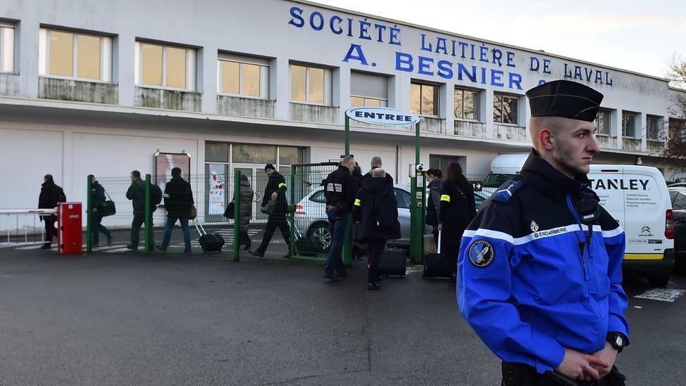 Investigators arrive at the Lactalis group headquarters on 17 January 2018