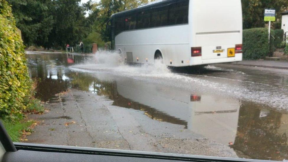 Bus driving through water