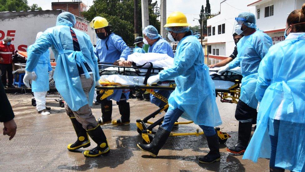 Medical staff move a bed-ridden patient from a hospital in Tula, Hidalgo state, Mexico. Photo: 7 September 2021