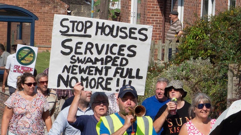 A sign reading: Stop Houses services swamped Newent full no more