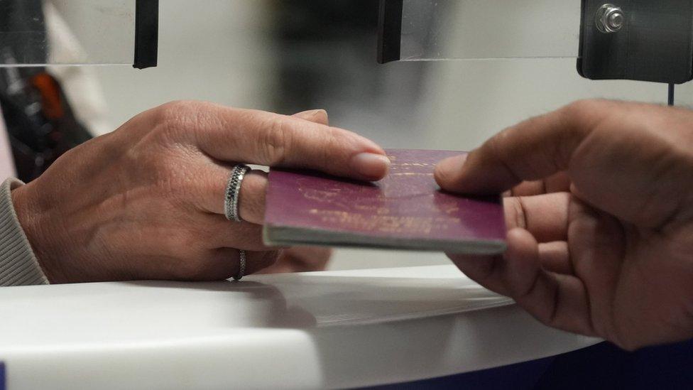 Passport check at UK Border Force check-in desk at Gatwick Airport