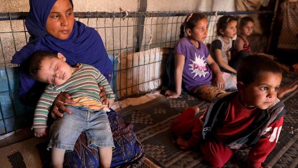 Displaced Syrian children inside their tent at Atmeh camp, near the Turkish border, Syria (13 June 2020)