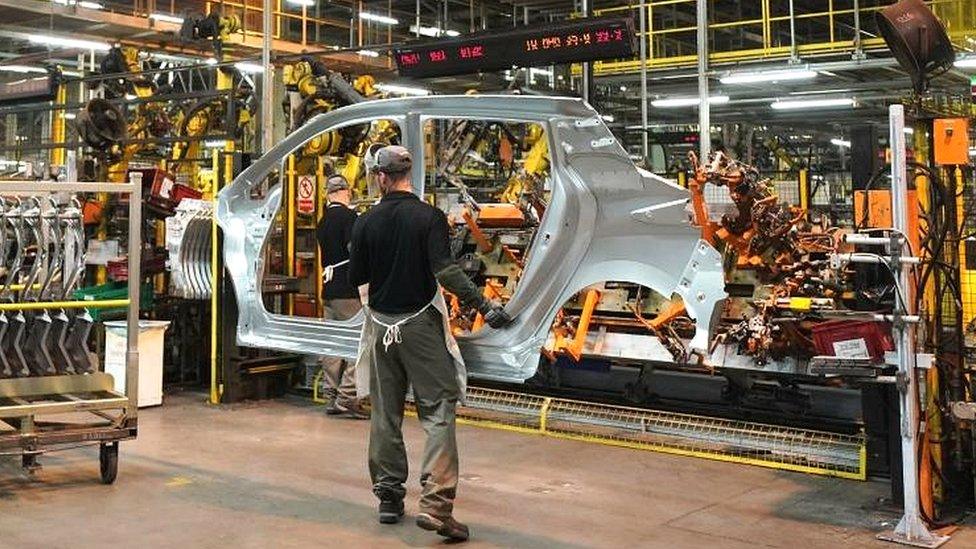 Workers on the production line at Nissan"s factory in Sunderland