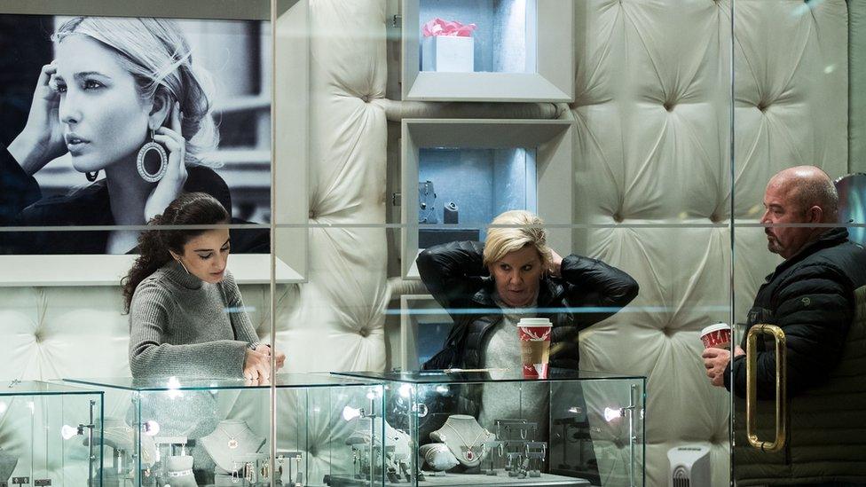 People browse jewellery at the "Ivanka Trump Collection" shop at Trump Tower, December 8, 2016 in New York City.