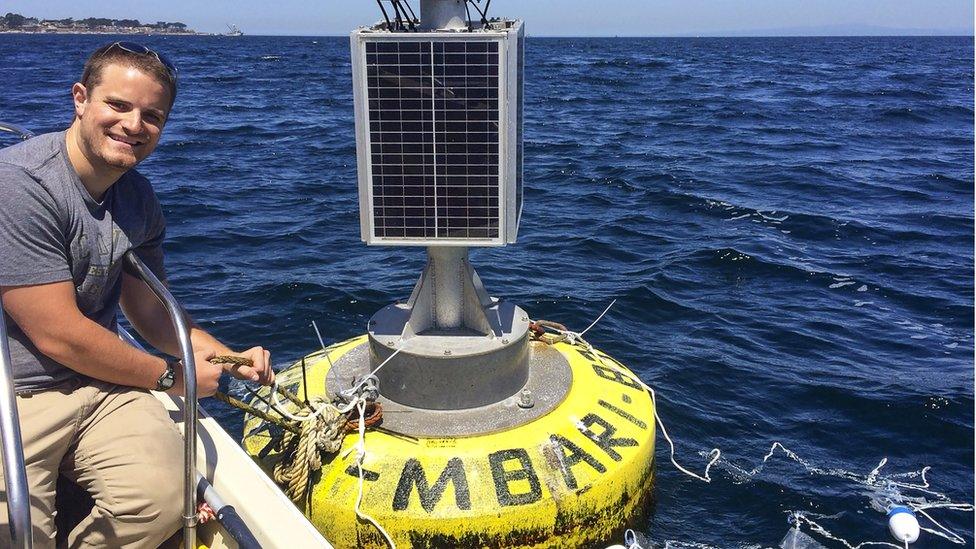 Deploying experimental plastic debris at a buoy in Monterey Bay, California