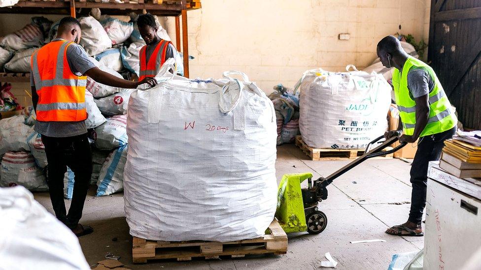 Bags of phones in a warehouse