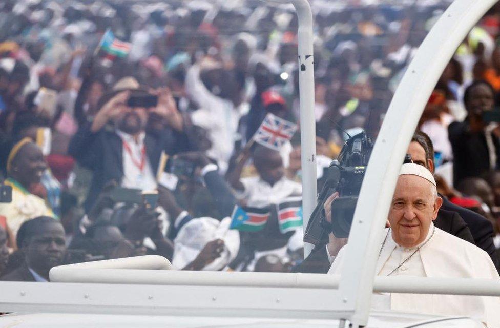 Pope Francis surrounded by crowds