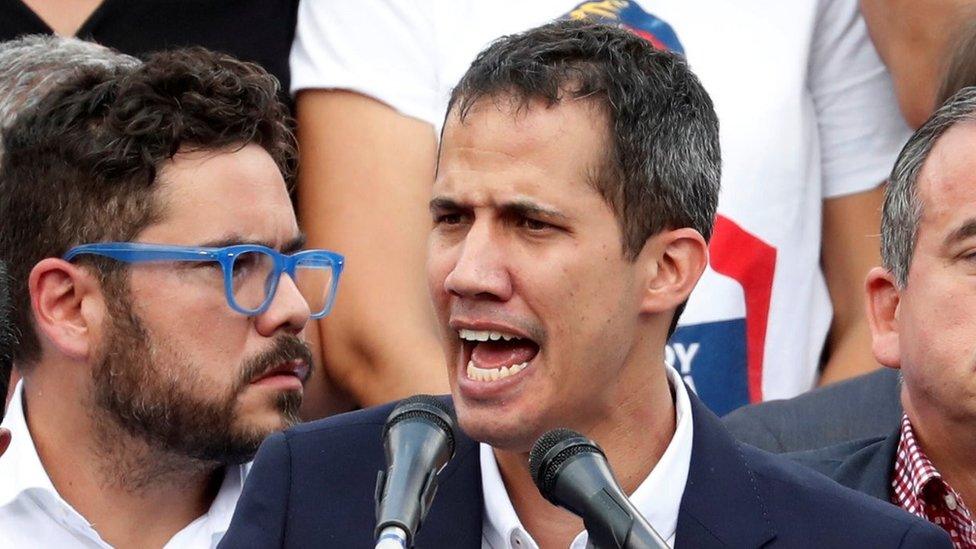 Venezuelan opposition leader Juan Guaido, who many nations have recognized as the country's rightful interim ruler, talks to supporters during a rally against Venezuelan President Nicolas Maduro"s government in Caracas, Venezuela March 4, 2019