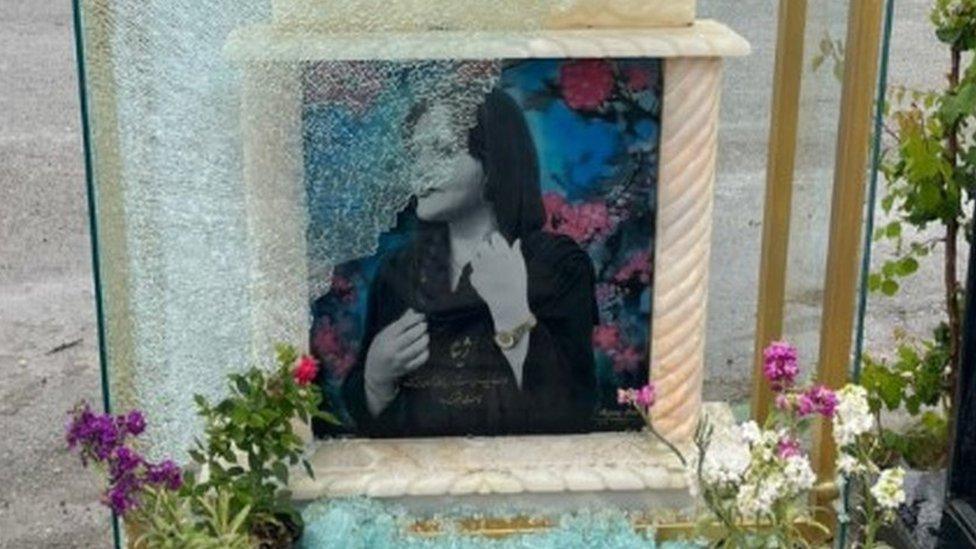 Photograph posted on Instagram by Ashkan Amini showing a broken pane of glass that was covering the tombstone of Mahsa Amini at a cemetery in Saqqez, Iran (21 May 2023)