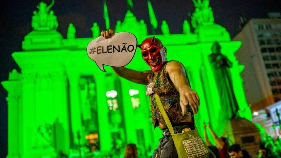 Demonstrators take part in a protest against Brazilian right-wing presidential candidate Jair Bolsonaro