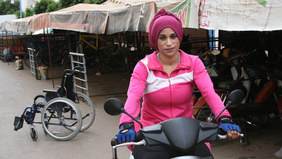 Fatiha Ait Mohamed riding her specially adapted motorbike