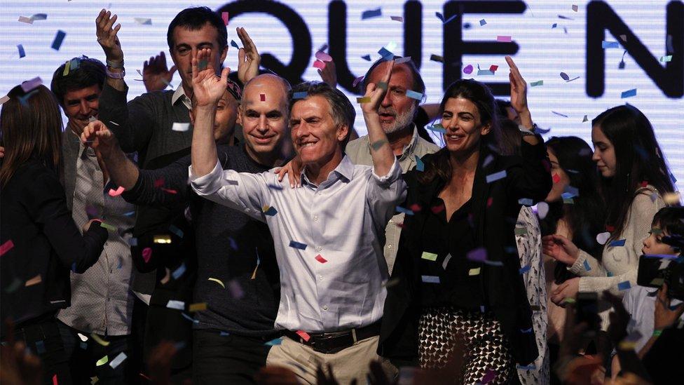 Mauricio Macri and his supporters celebrate as confetti falls