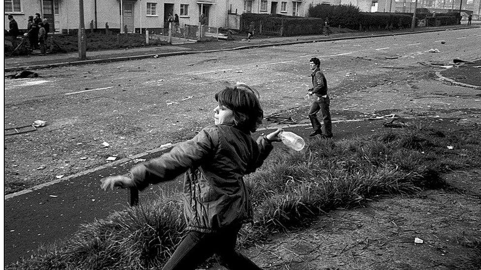 Ann Marie, aged 10, throwing bottles at British troops in 1981