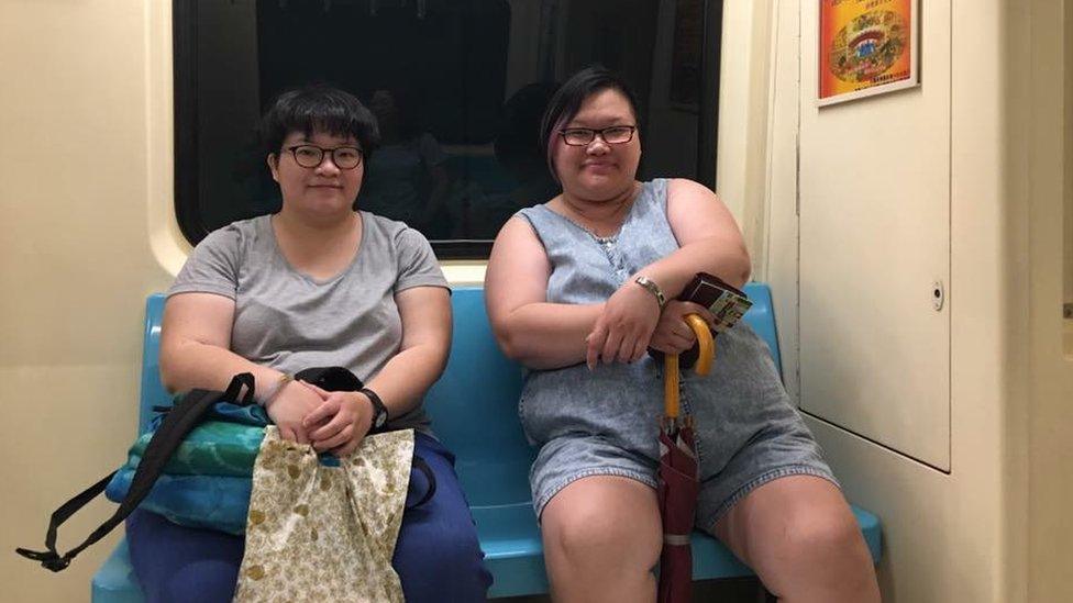 Mallie and Amy on the metro in Taipei