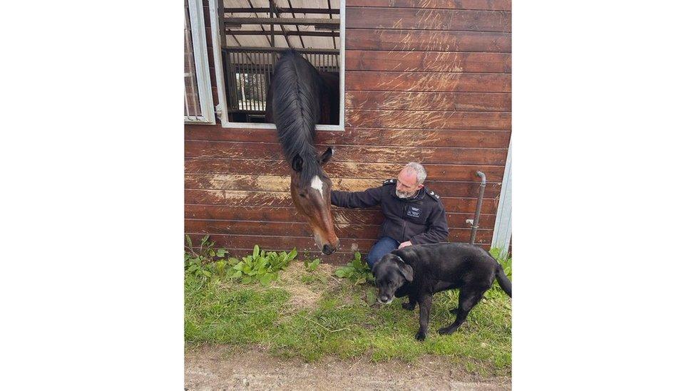 Urbane and his vet and his Labrador