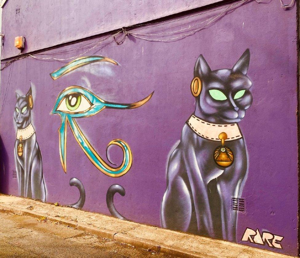 Port Talbot street art of cats and an eye