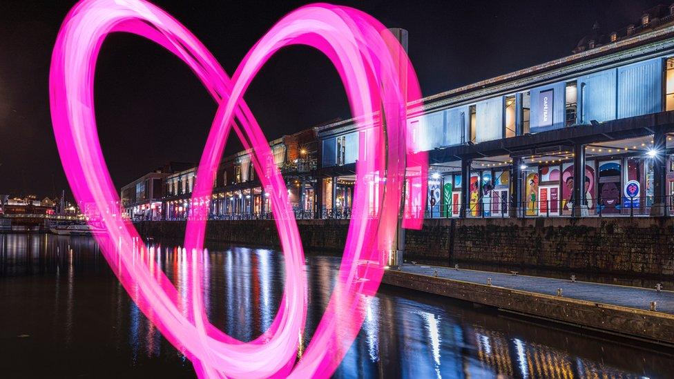 Graphic image of a heart in front of the harbourside