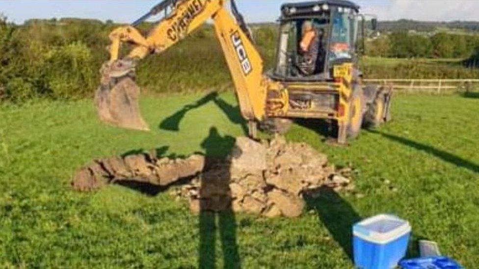 Redrow digger creating test pits