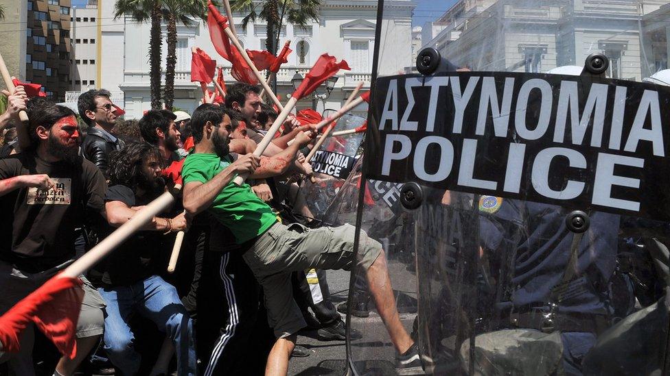 Demonstrators clash with policemen outside the greek Parliament during a Mayday demonstration on May 1, 2010, in Athens.