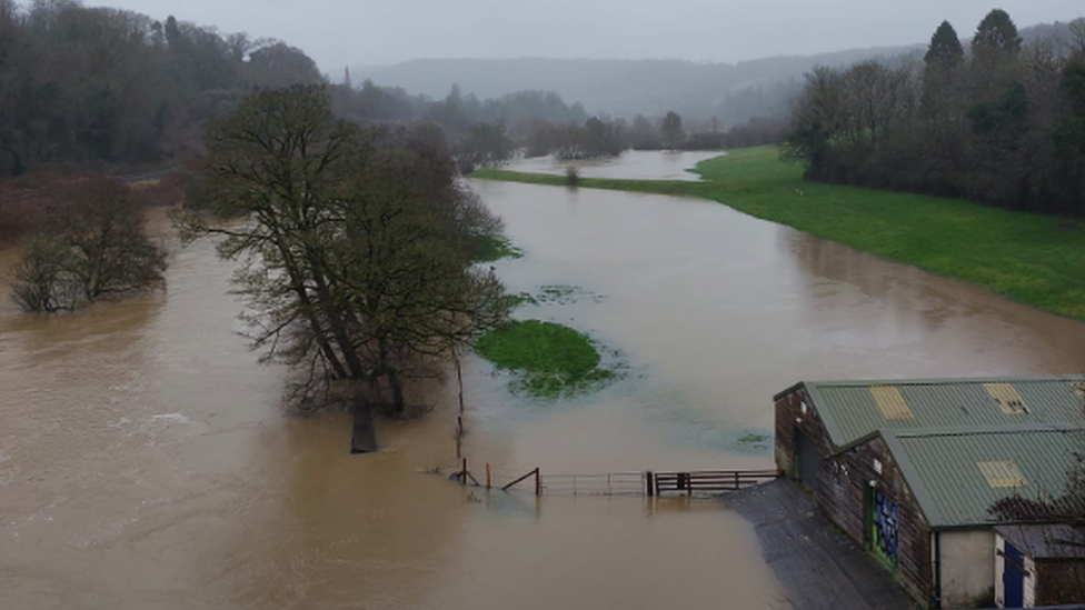 Dundas Aqueduct flooded with trees and some buildings submerged