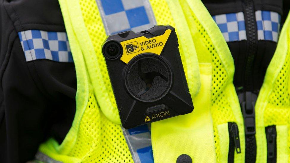 Police wearing body-worn camera - stock image