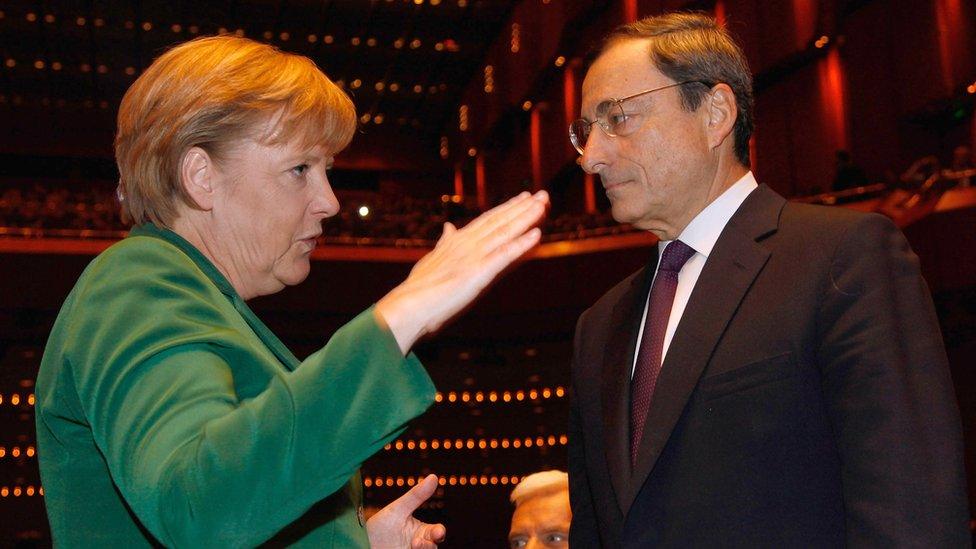 File pic from 2011 of Angela Merkel with Mario Draghi