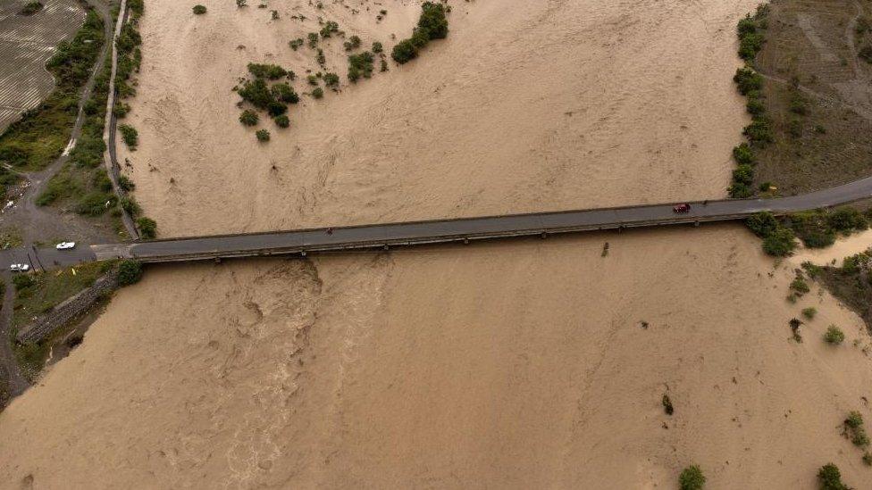 Aerial photograph showing the Ocoa River bursting its banks due to heavy rains, in Palmar de Ocoa, Dominican Republic 18 November 2023.