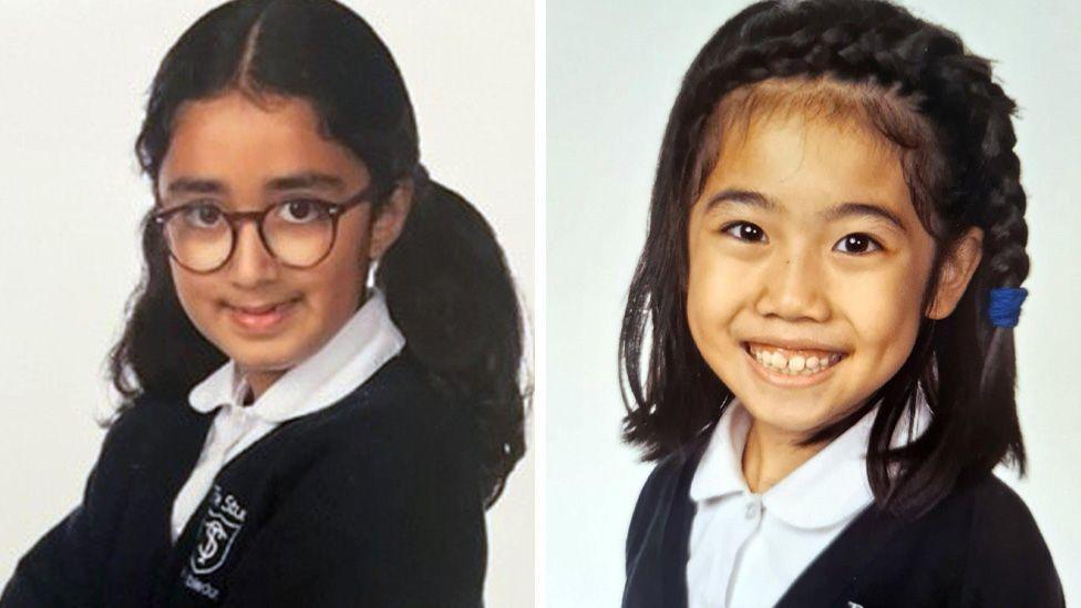 Composite of school portraits showing Nuria Sajjad on the left and Selena Lau on the right. Both are wearing white blouses and school cardigans, and Nuria has her hair in bunches and is wearing glasses, while Selena has her plaited to one side, both girls are smiling at the camera.