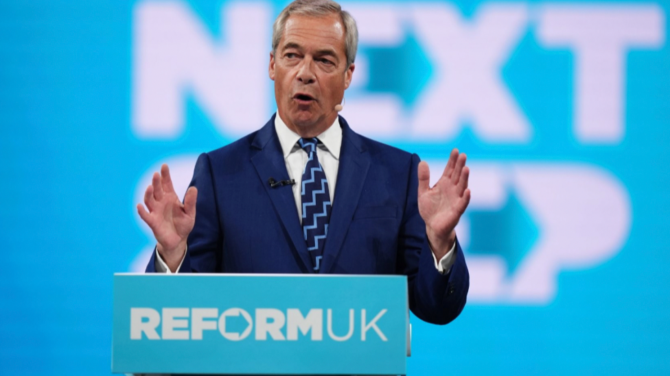 Nigel Farage speaking at the Reform Party Conference.