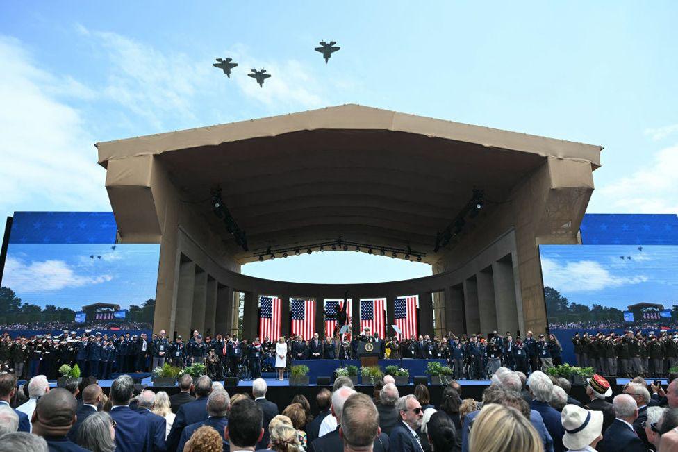 US F35 fighter jets fly over the US ceremony marking the 80th anniversary of the World War II "D-Day" Allied landings in Normandy, at the Normandy American Cemetery and Memorial in Colleville-sur-Mer, which overlooks Omaha Beach 