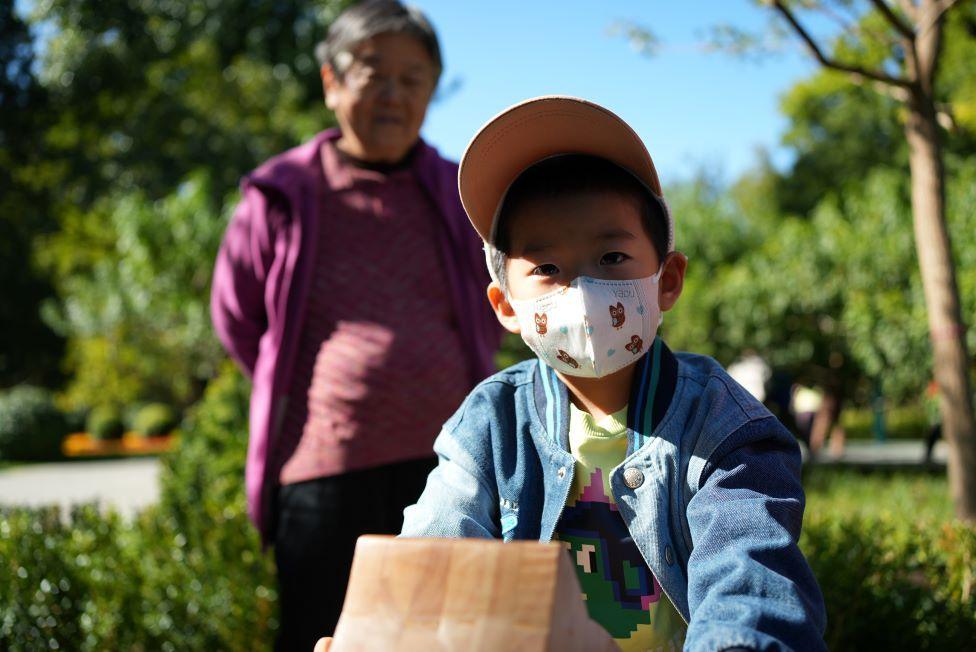 Boy wearing mask in Ritan Park