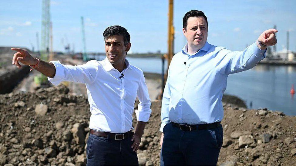 Prime Minister Rishi Sunak and Tees Valley Mayor Ben Houchen point while standing at the Teesworks site