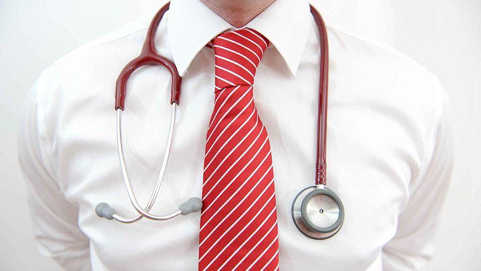Generic image of a GP's chest, with a stethoscope round the neck