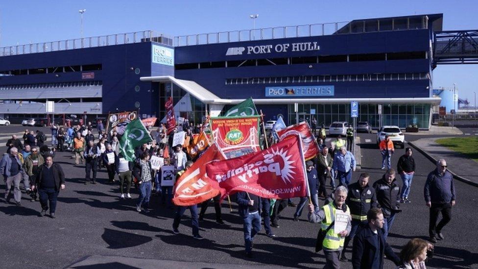 Protestors waving flags and banners outside the P&O Ferries terminal in Hull